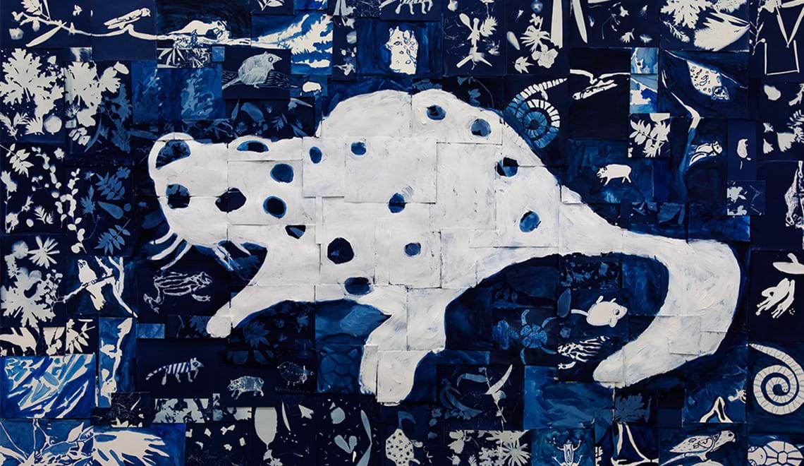 This image shows a dark blue and white painting of a quoll. it has spots and is surrounded by smaller blue and white artworks.