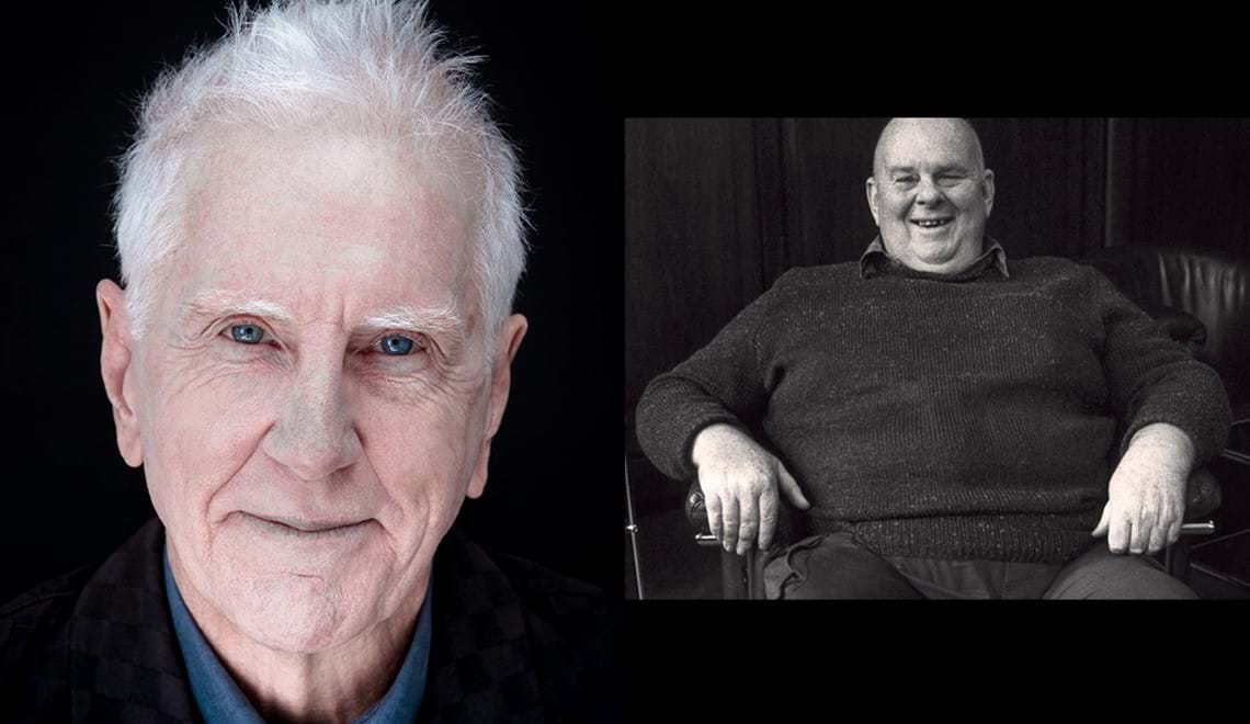 Les Murray sits on a chair wearing a jumper. He is smiling. Peter Caroll wears a blue shirt with a black jacket, he has short grey hair and blue eyes.