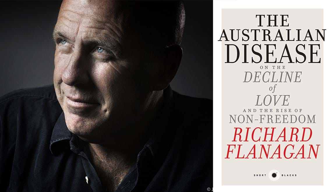 Richard Flanagan is looking to the left, wearing a black button up shirt and smiling