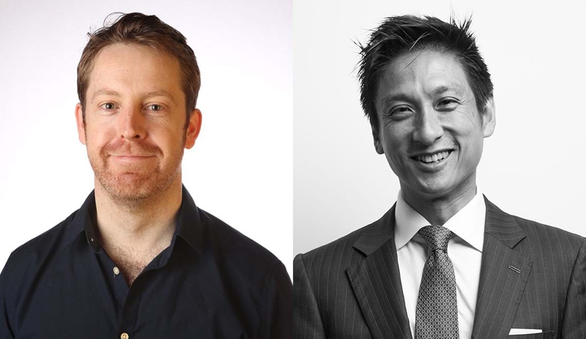 David Brophy (left) has red hair and stubble and is wearing a dark blue shirt. Jason Yat-Sen Li (right) is wearing a striped suit - you cannot tell the colour as his is a black and white photo. Both men are smiling at the camera.