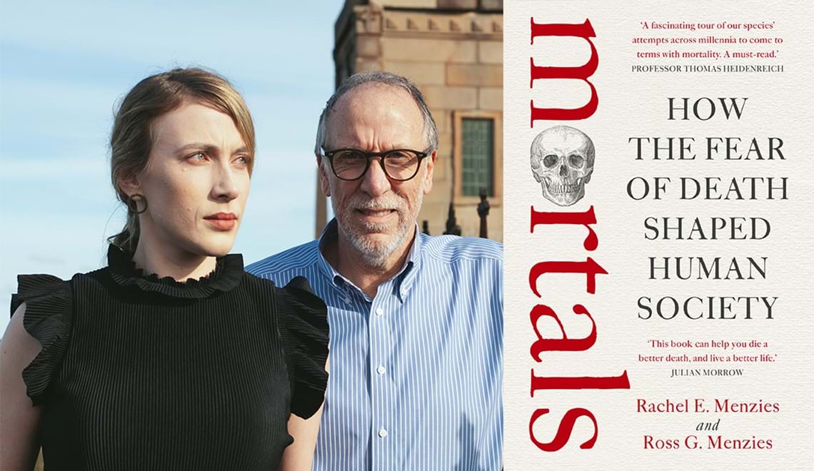 Rachel Menzies has blonde hair and is wearing a ruffled black top; she is looking away from the camera. Ross Menzies has grey hair and a beard, and is wearing glasses and a blue striped shirt; he is looking at the camera with a serious expression.